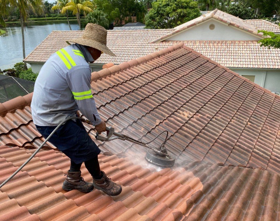 Smart Choice technician pressure-cleaning a tile roof